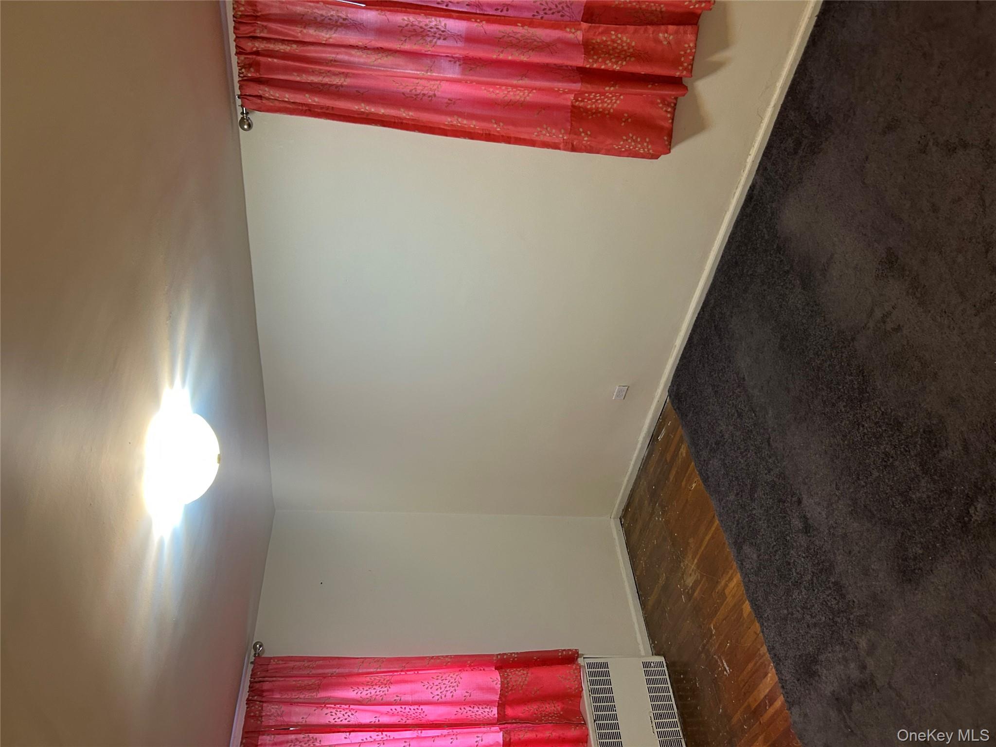 83-25 98th Street, Unit 2C Queens, NY 11421 - Photo 13 of 18 a view of a room with window and carpet
