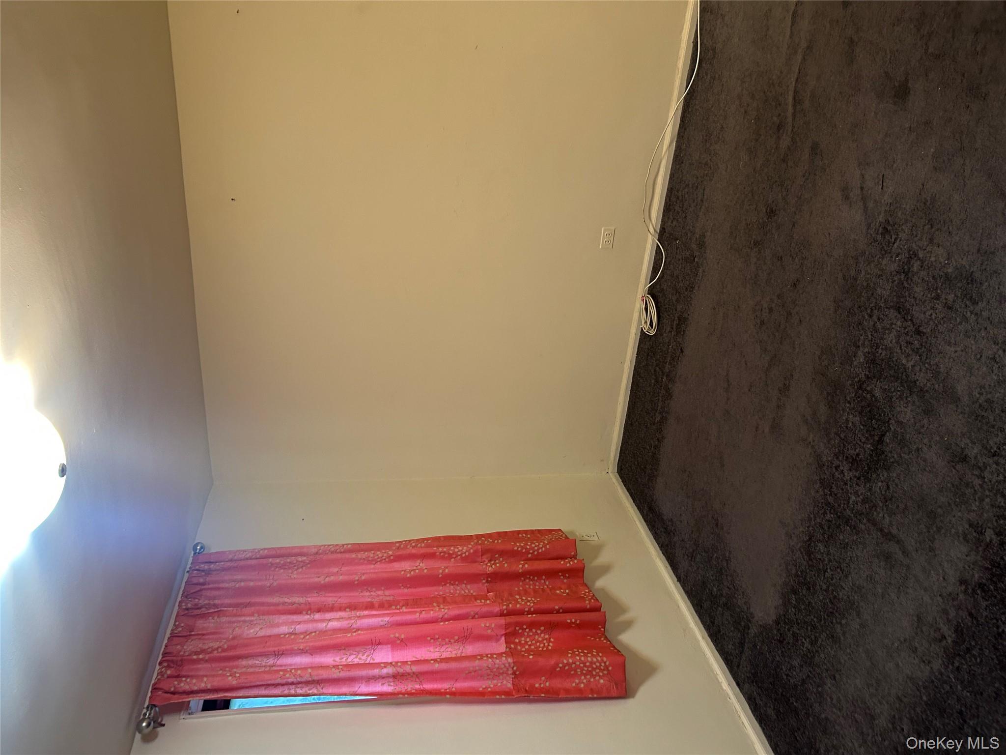83-25 98th Street, Unit 2C Queens, NY 11421 - Photo 18 of 18 a view of a room with wooden floor and windows
