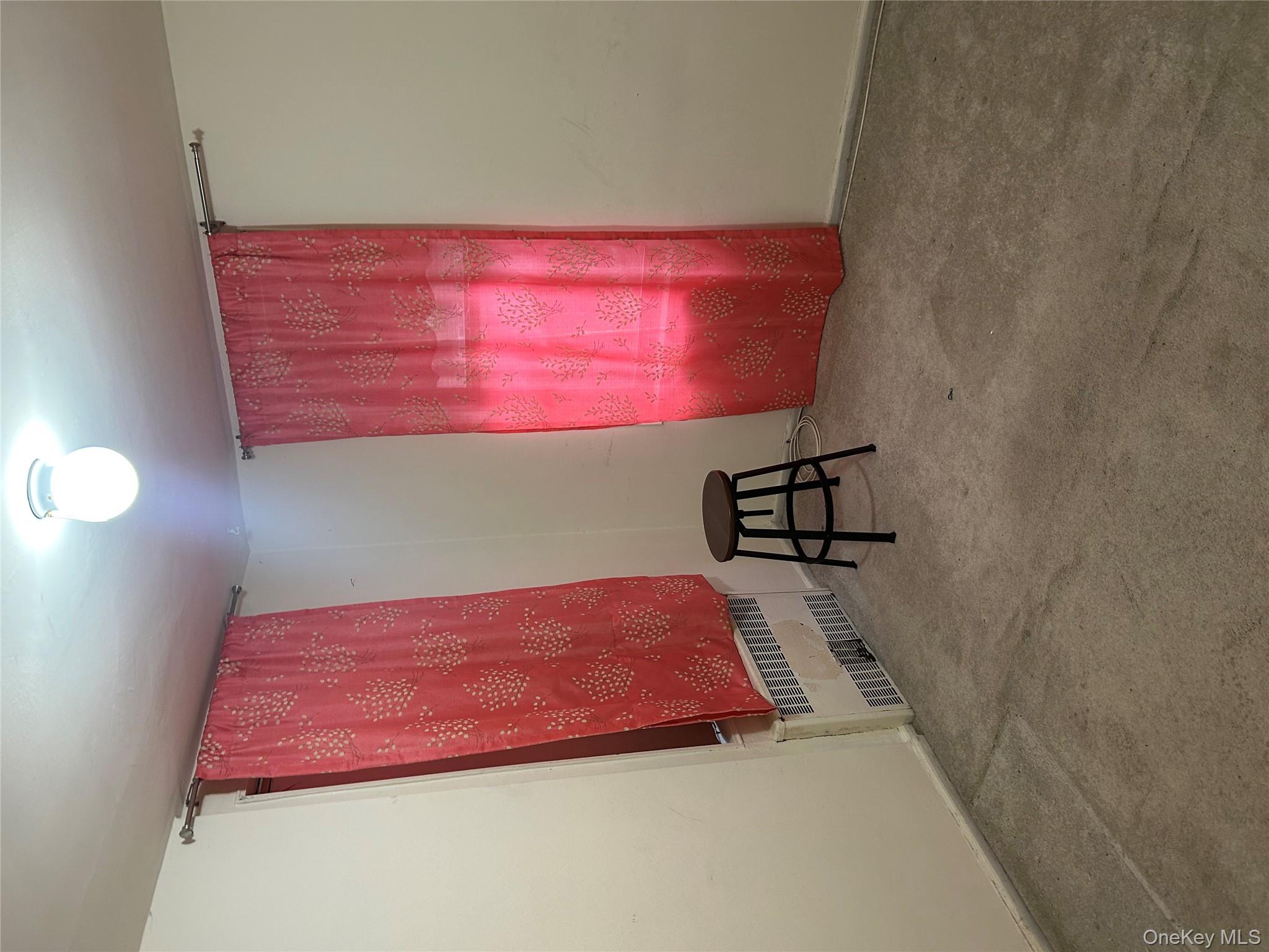 83-25 98th Street, Unit 2C Queens, NY 11421 - Photo 10 of 18 an empty room with windows