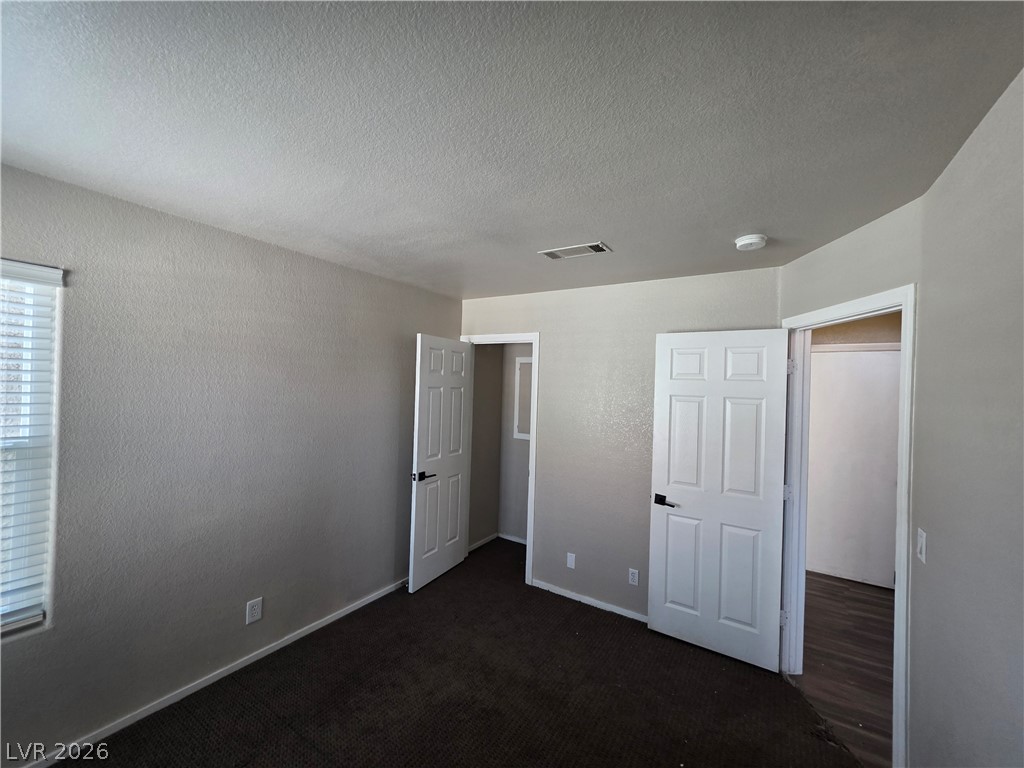 2275 Ramsgate Drive Henderson, NV 89074 - Photo 73 of 84 Well-lit and carpeted room offering comfortable and versatile living space.