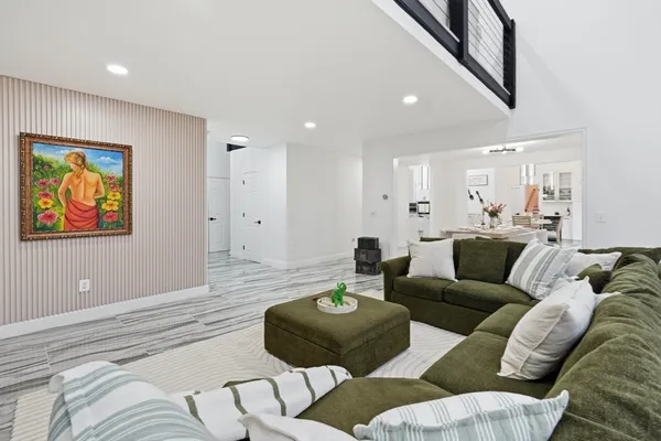 a living room with furniture and a rug