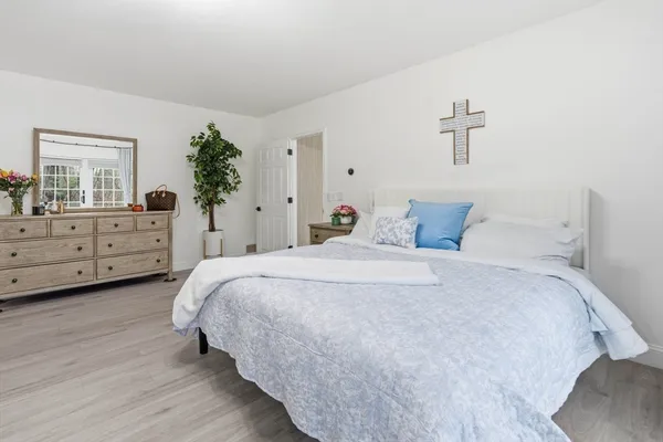 a bedroom with a bed and a dresser