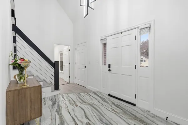 a view of a hallway view with staircase