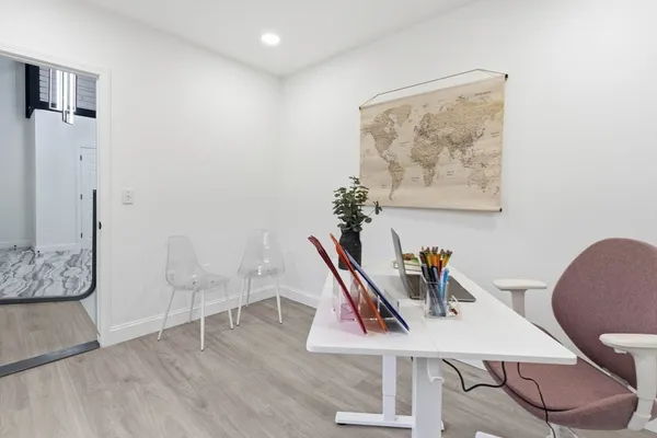 a workspace with furniture and wooden floor