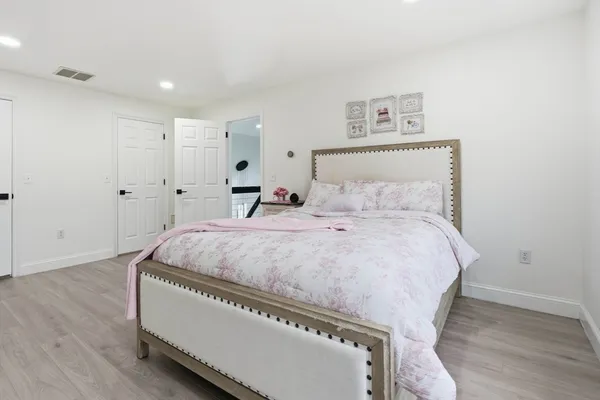 a bedroom with a bed and a table