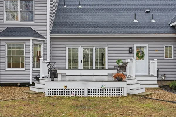 a view of a house with a large window and couch