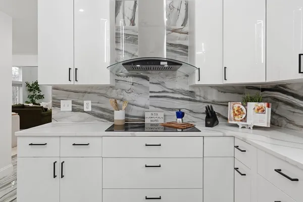 a kitchen with stainless steel appliances a sink and cabinets