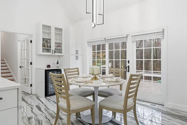 a dining room with furniture and window