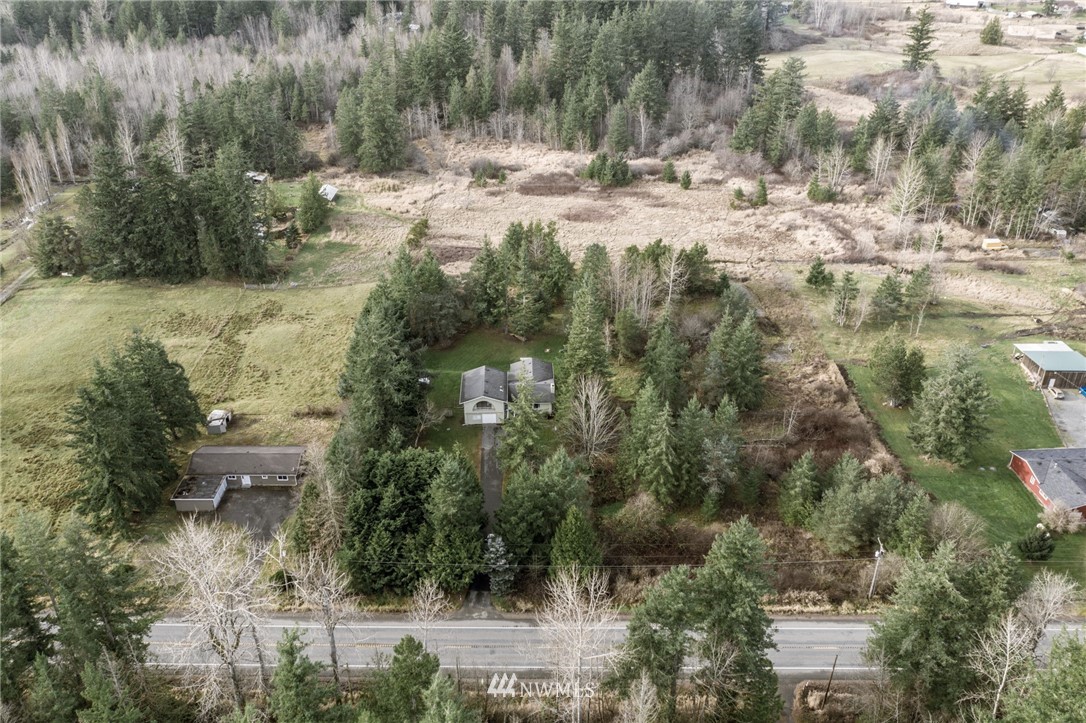 5215 Everson Goshen Road Bellingham, WA 98226 - Photo 2 of 25 a view of a yard with a tree