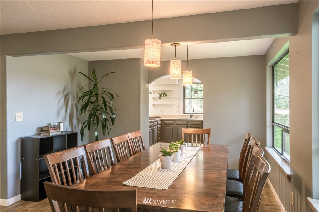 5215 Everson Goshen Road Bellingham, WA 98226 - Photo 11 of 25 a view of a dining room with furniture window and wooden floor