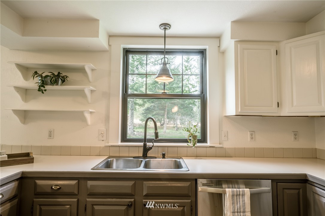 5215 Everson Goshen Road Bellingham, WA 98226 - Photo 15 of 25 a kitchen with a sink and a window