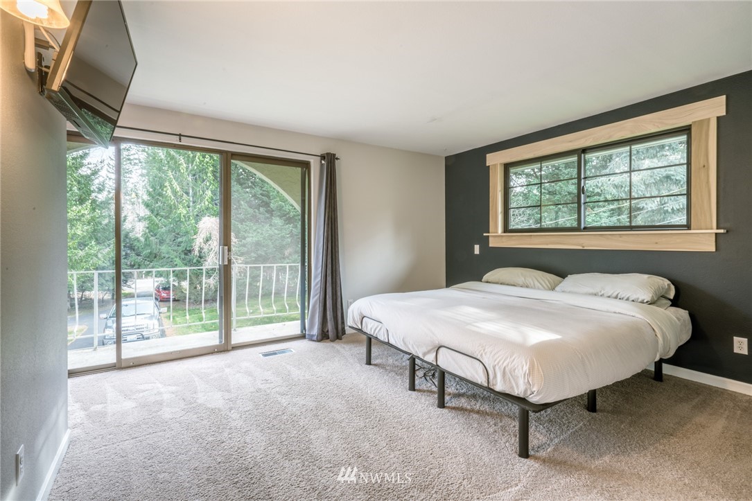 5215 Everson Goshen Road Bellingham, WA 98226 - Photo 21 of 25 a bedroom with a bed and a large window
