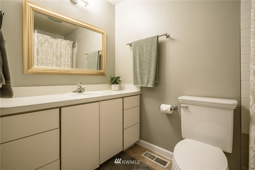 5215 Everson Goshen Road Bellingham, WA 98226 - Photo 24 of 25 a bathroom with a sink a toilet and shower