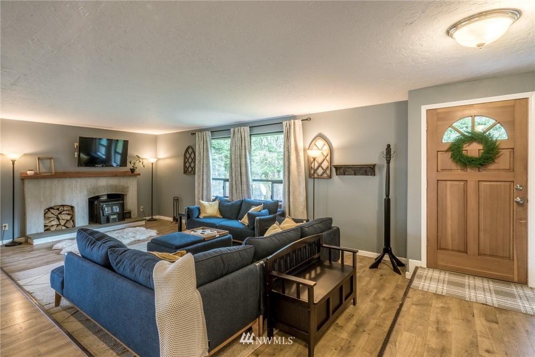 5215 Everson Goshen Road Bellingham, WA 98226 - Photo 5 of 25 a living room with furniture and a fireplace