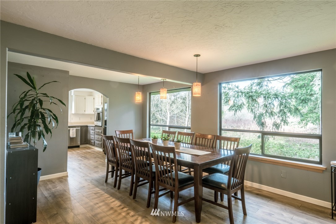 5215 Everson Goshen Road Bellingham, WA 98226 - Photo 10 of 25 a view of a dining room with furniture window and wooden floor