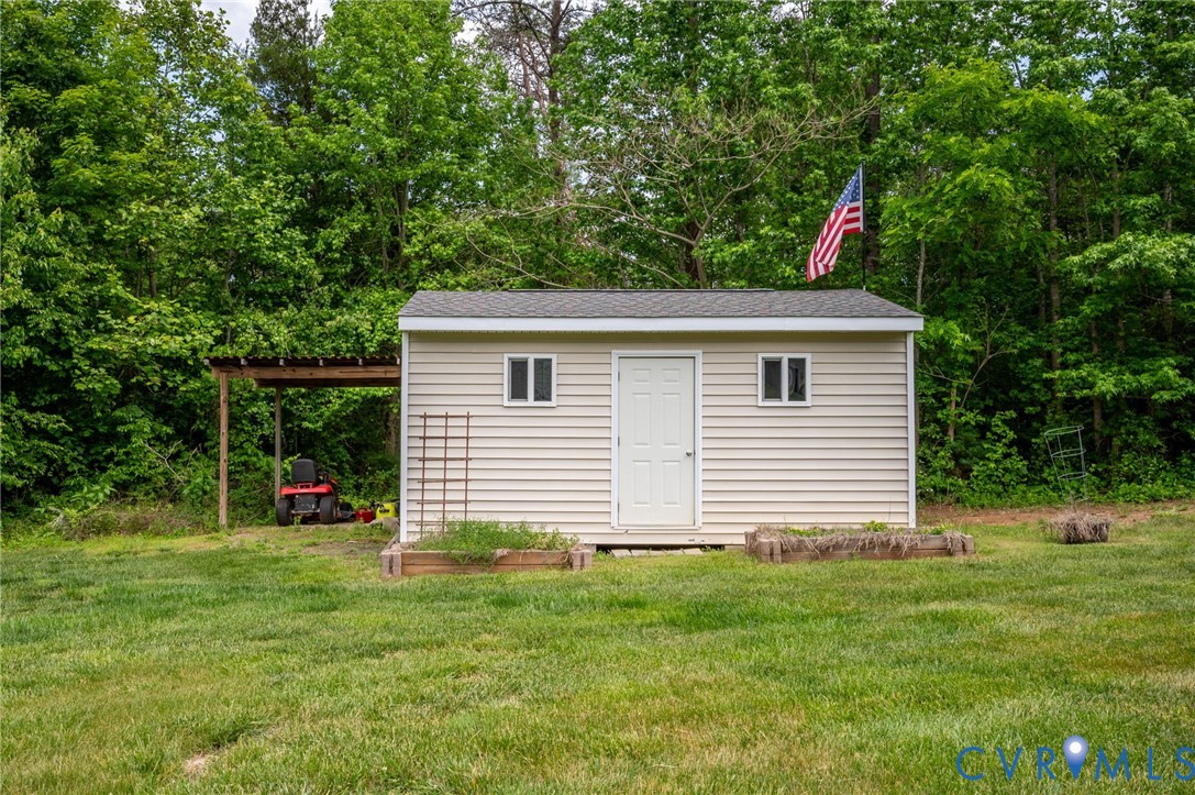 3090 Poor House Road Goochland, VA 23063 - Photo 30 of 32 Outdoor storage shed with light-toned siding, a wh