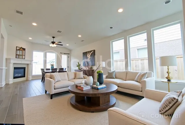 a living room with furniture fireplace and window