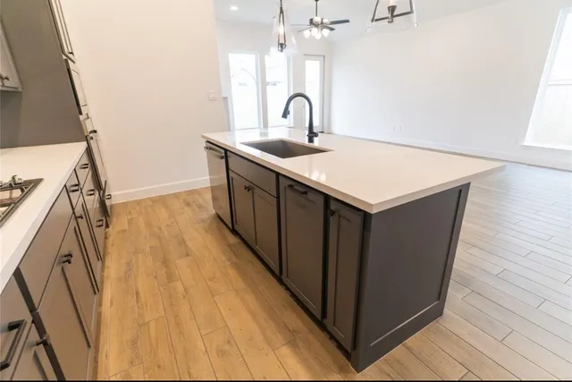 a utility room with sink dryer and washer