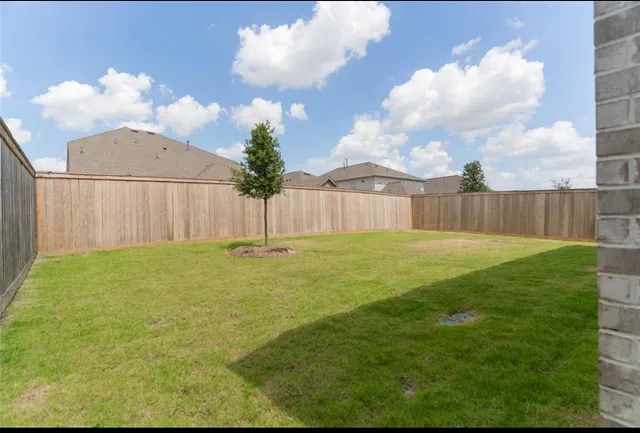 a swimming pool with outdoor seating and garden