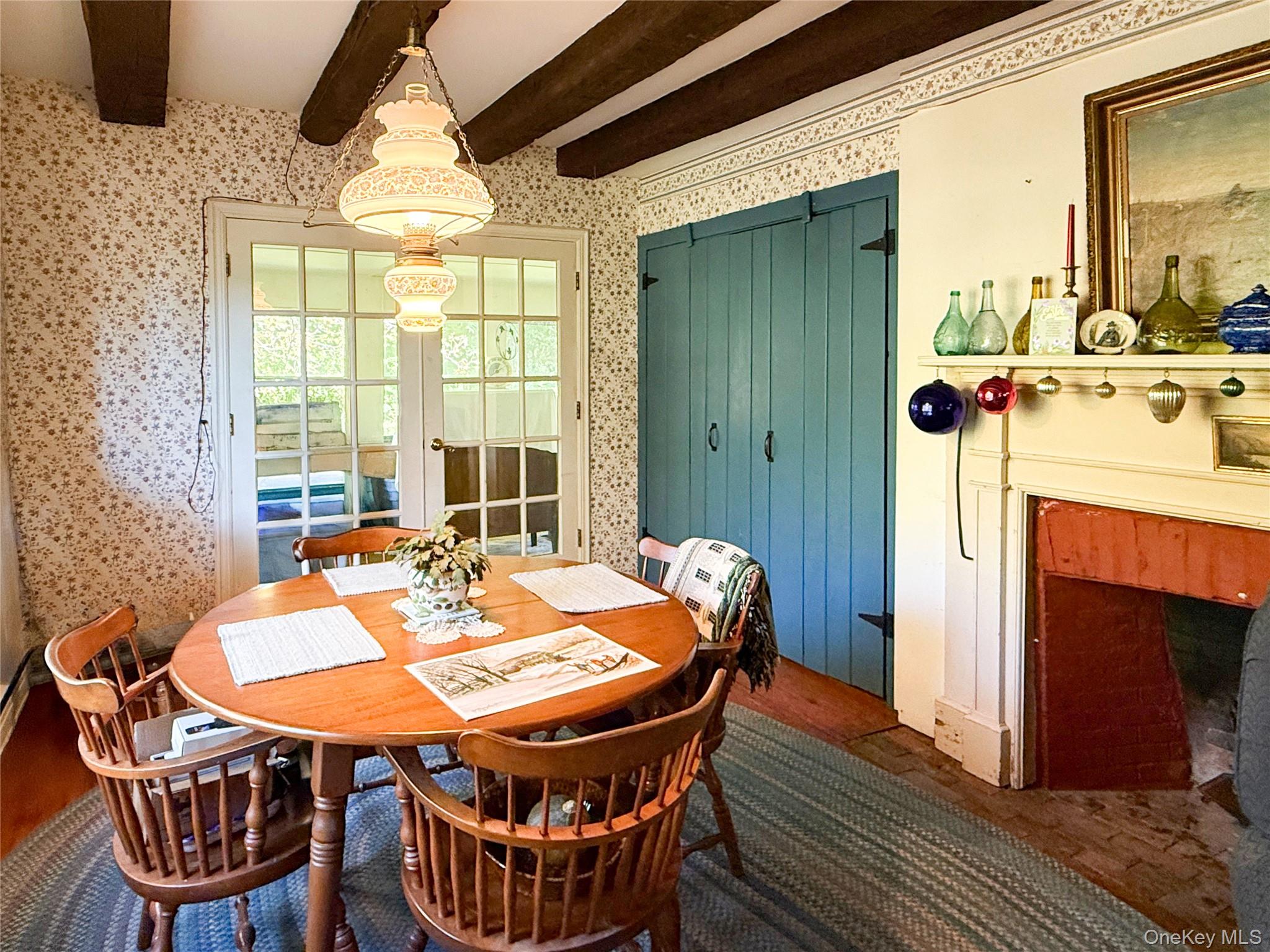 4 Plains Road Walden, NY 12586 - Photo 12 of 31 a dining room with furniture a fireplace and wooden floor