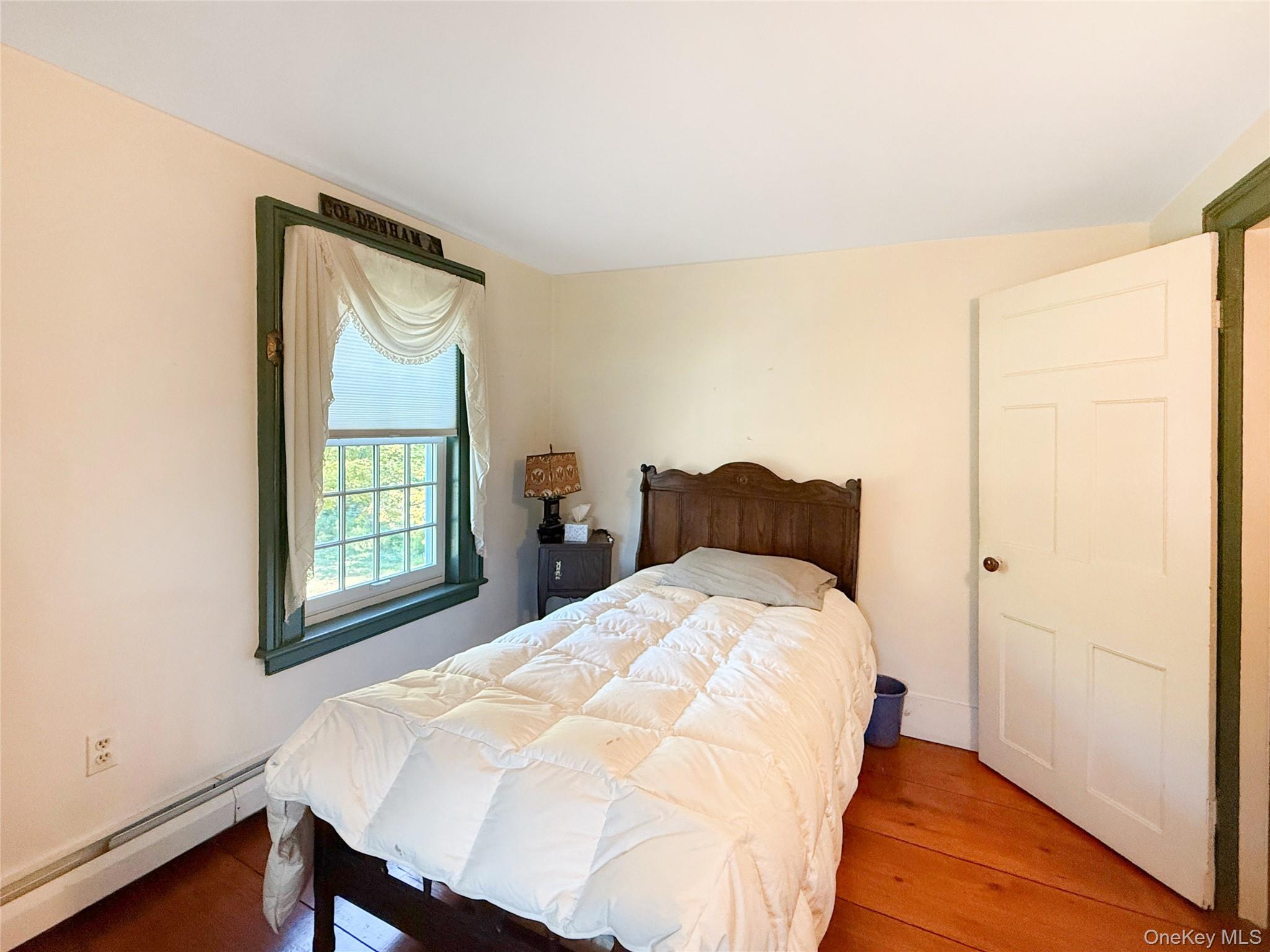 4 Plains Road Walden, NY 12586 - Photo 22 of 31 a bed sitting in a bedroom next to a window