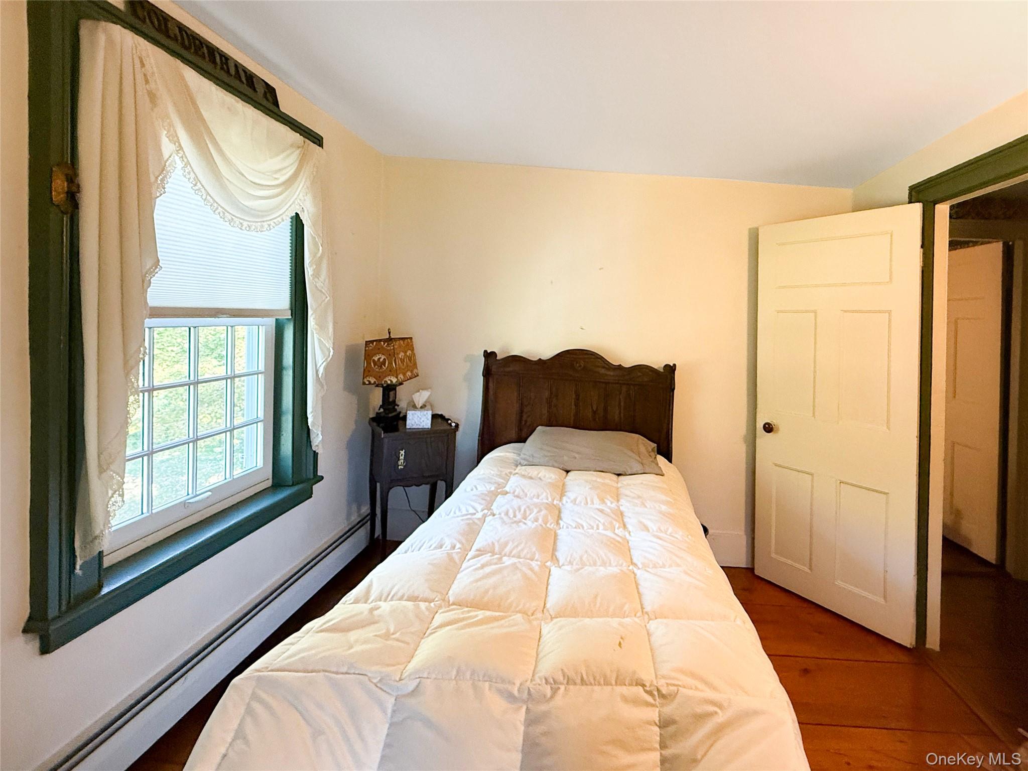 4 Plains Road Walden, NY 12586 - Photo 24 of 31 a bedroom with a bed and a large window
