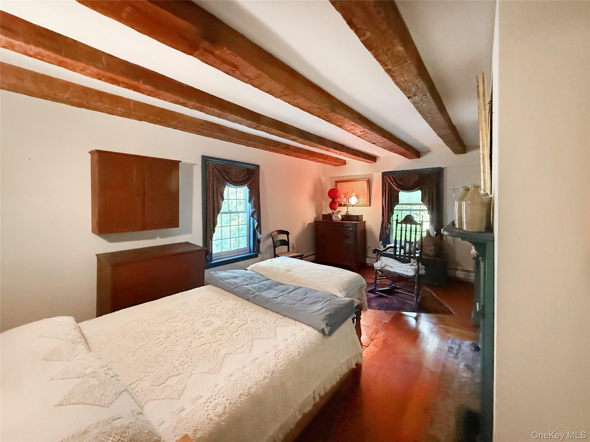 4 Plains Road Walden, NY 12586 - Photo 25 of 31 a bedroom with a bed and a large mirror