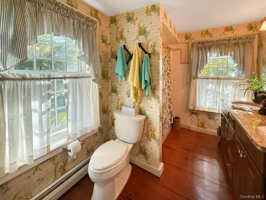 4 Plains Road Walden, NY 12586 - Photo 30 of 31 a bathroom with a granite countertop toilet a sink and a large window