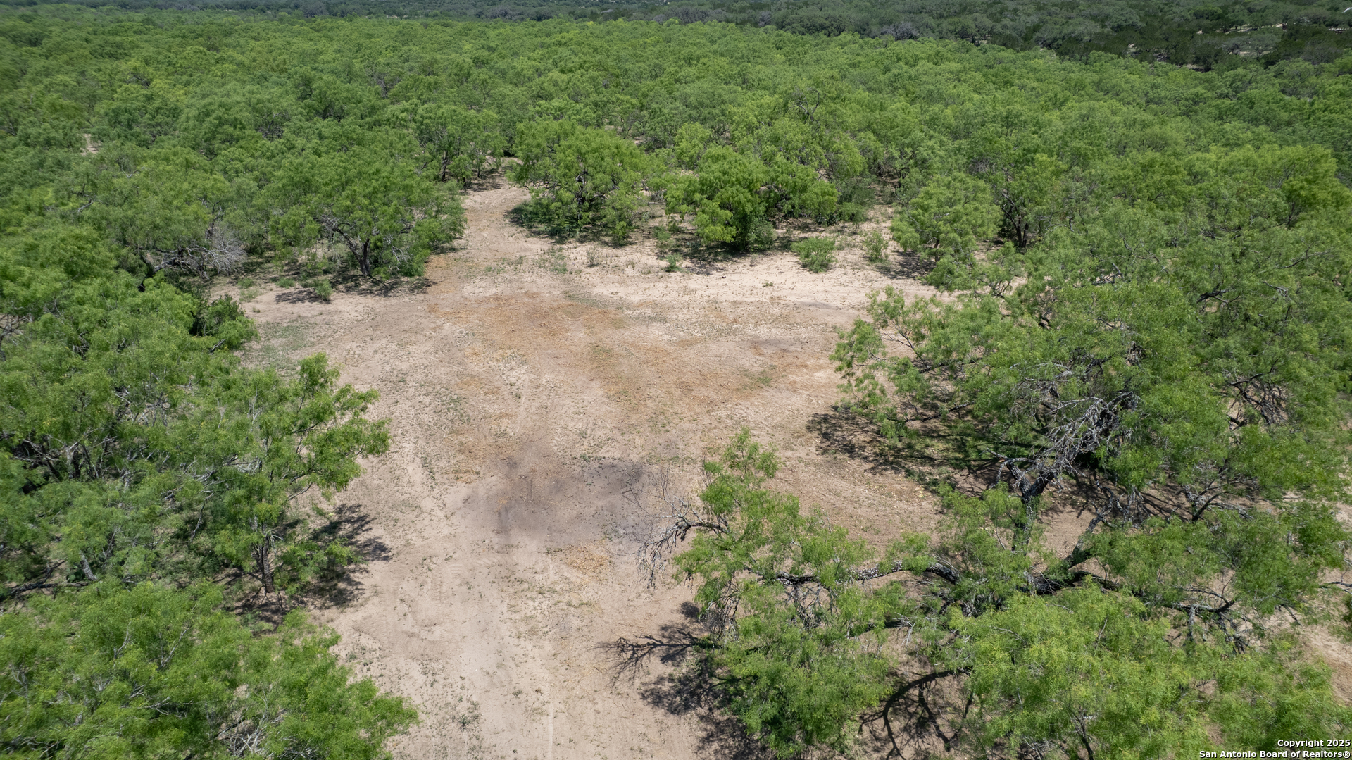 405 Ridge Loop Rio Frio, TX 78879 - Photo 17 of 32 a view of a pathway with a yard