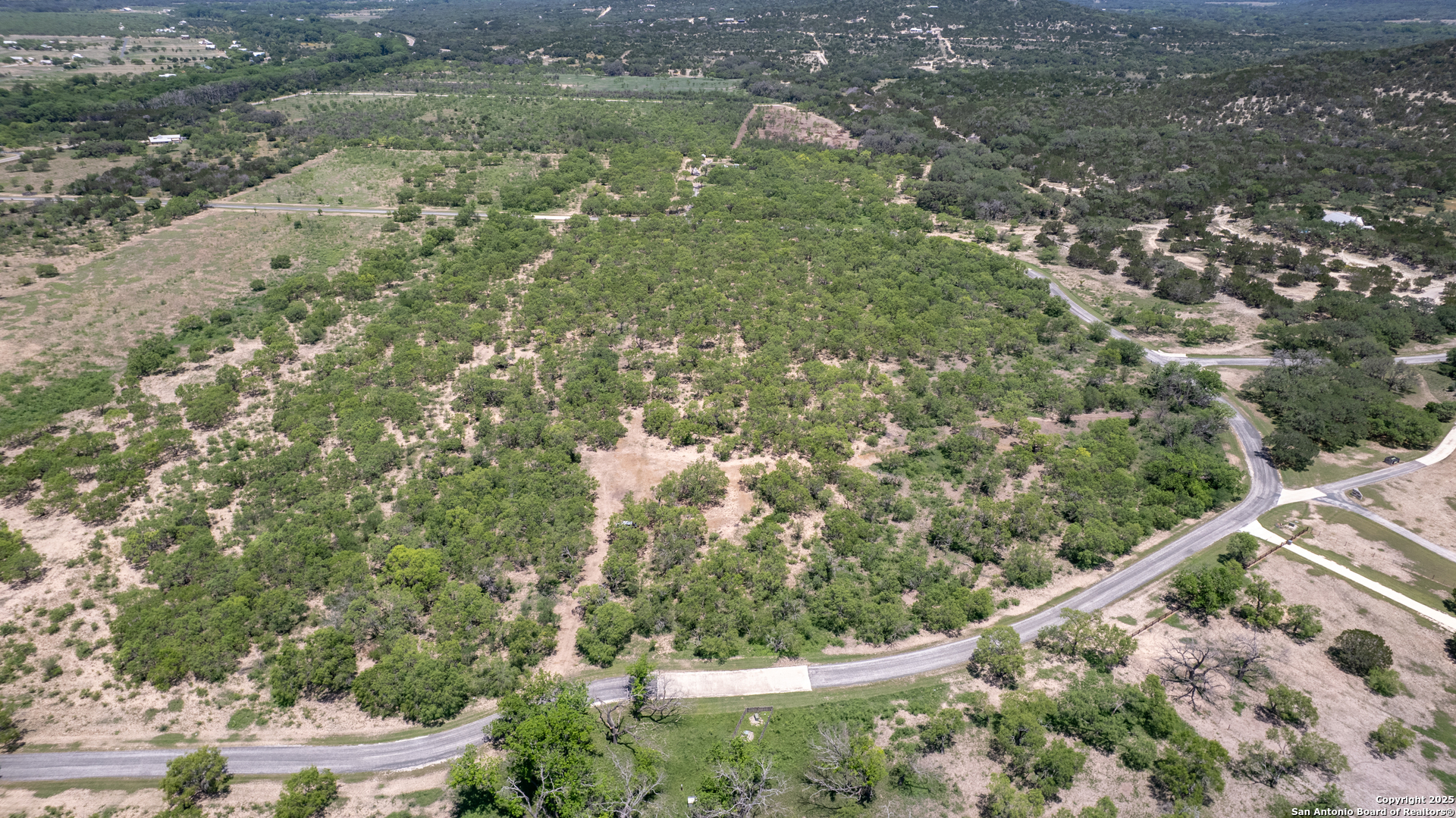 405 Ridge Loop Rio Frio, TX 78879 - Photo 21 of 32 a view of a lake from a balcony