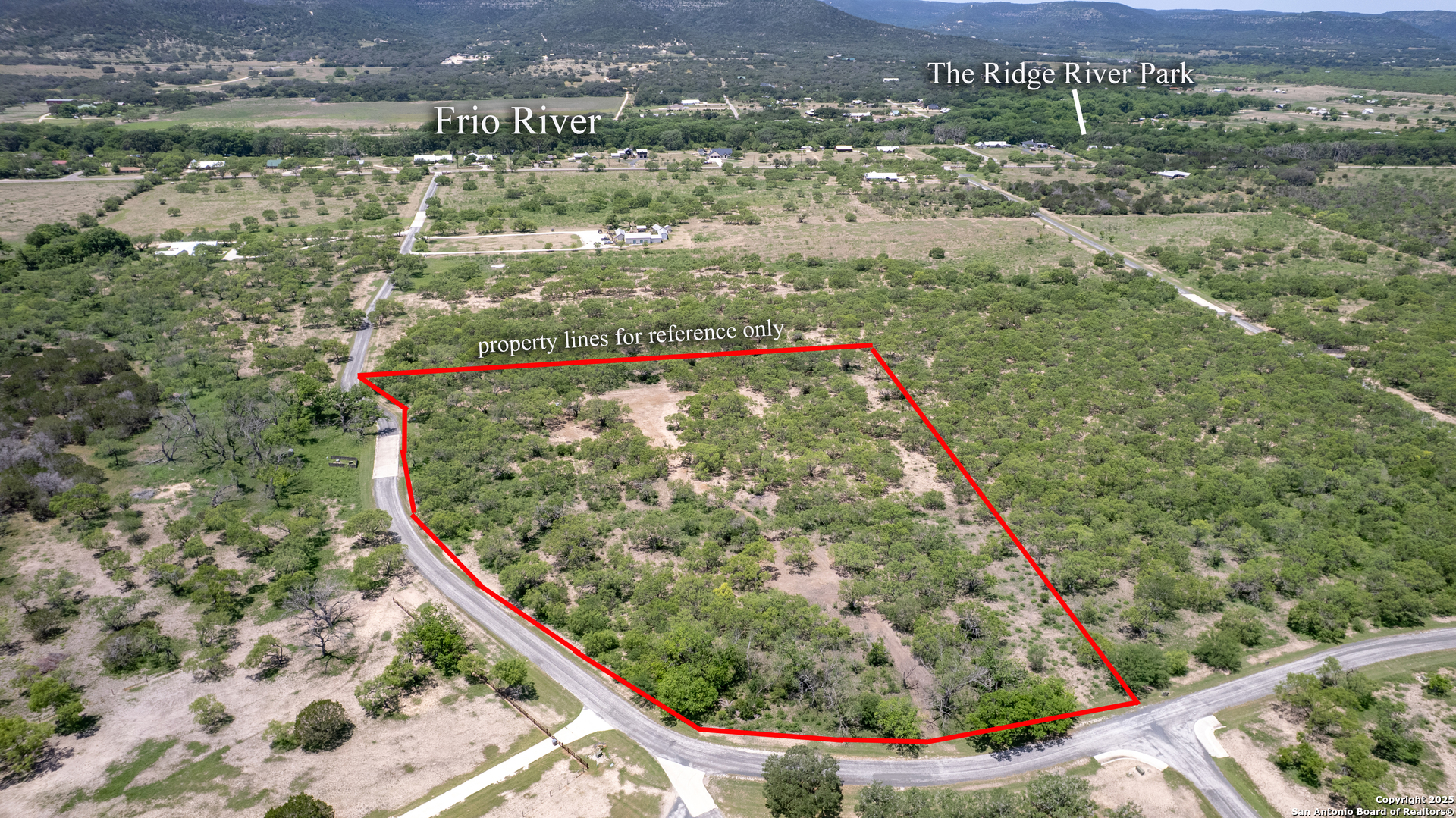 405 Ridge Loop Rio Frio, TX 78879 - Photo 23 of 32 a view of a lake with a mountain