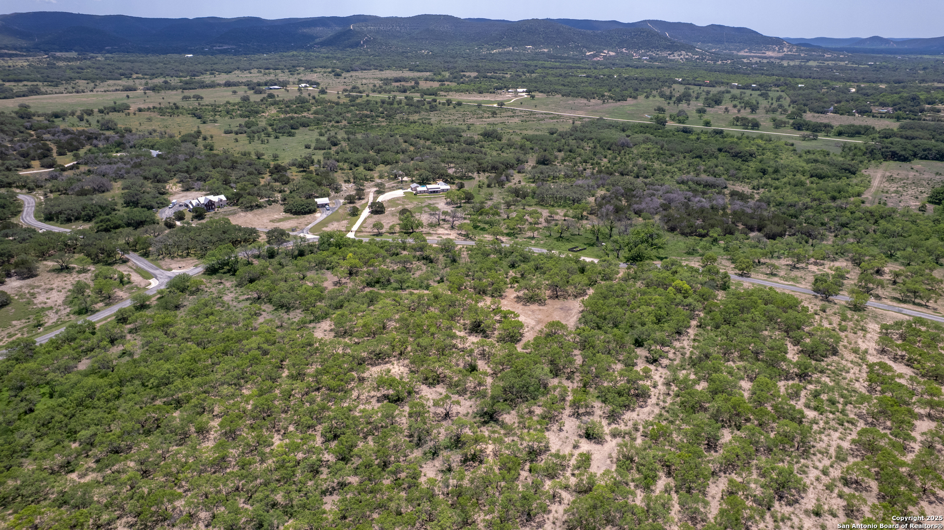 405 Ridge Loop Rio Frio, TX 78879 - Photo 25 of 32 a view of a lush green field with lots of bushes
