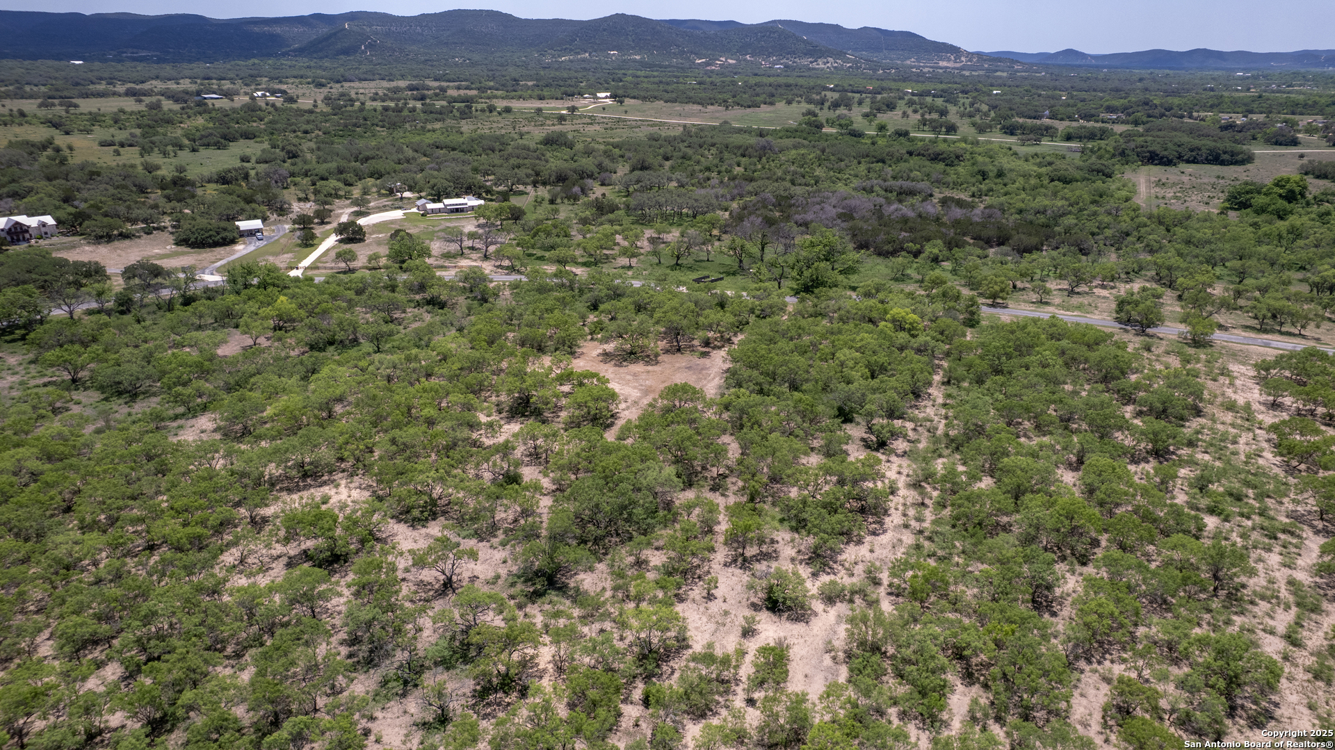 405 Ridge Loop Rio Frio, TX 78879 - Photo 26 of 32 a view of a lush green hillside and houses