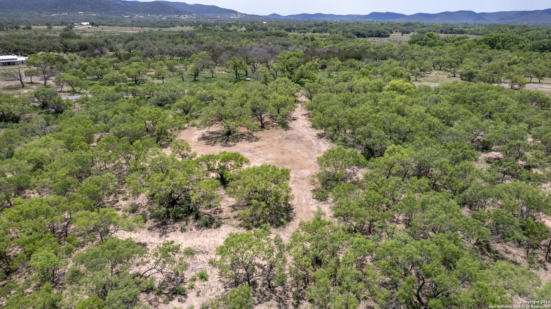 405 Ridge Loop Rio Frio, TX 78879 - Photo 27 of 32 a view of a lush green hillside and houses