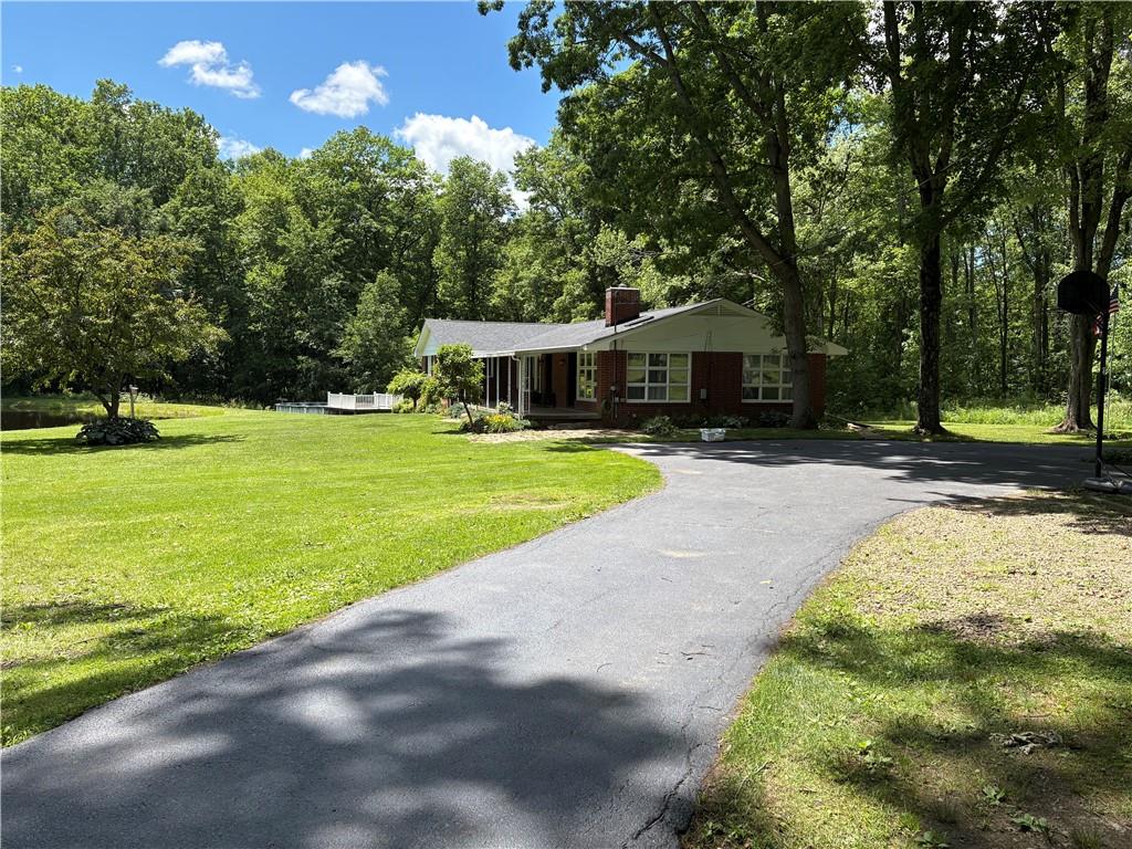 320 Cherry Hill Road Greenville, PA 16125 - Photo 32 of 38 a view of a house with a yard and sitting area