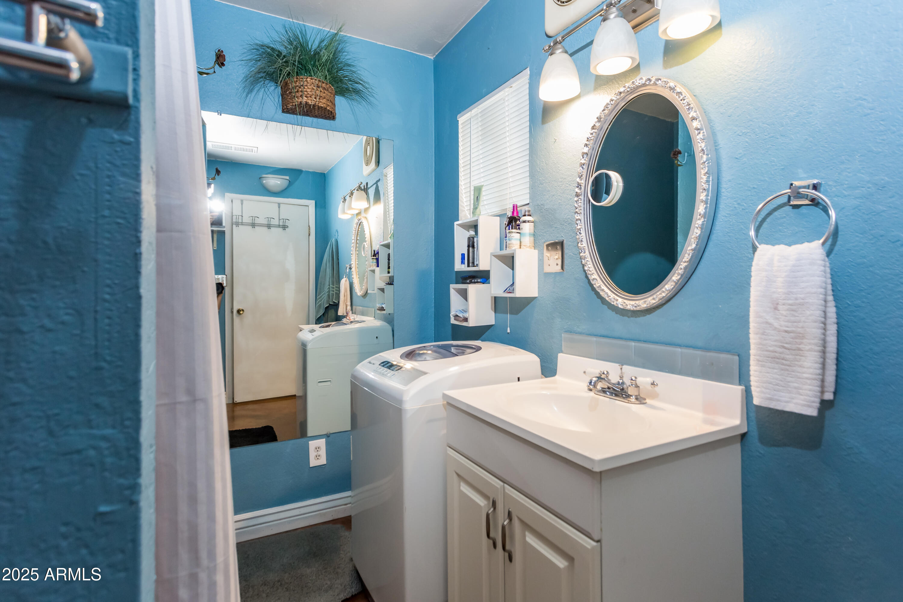 37 West Pasadena Avenue Phoenix, AZ 85013 - Photo 8 of 37 a bathroom with a sink and a mirror