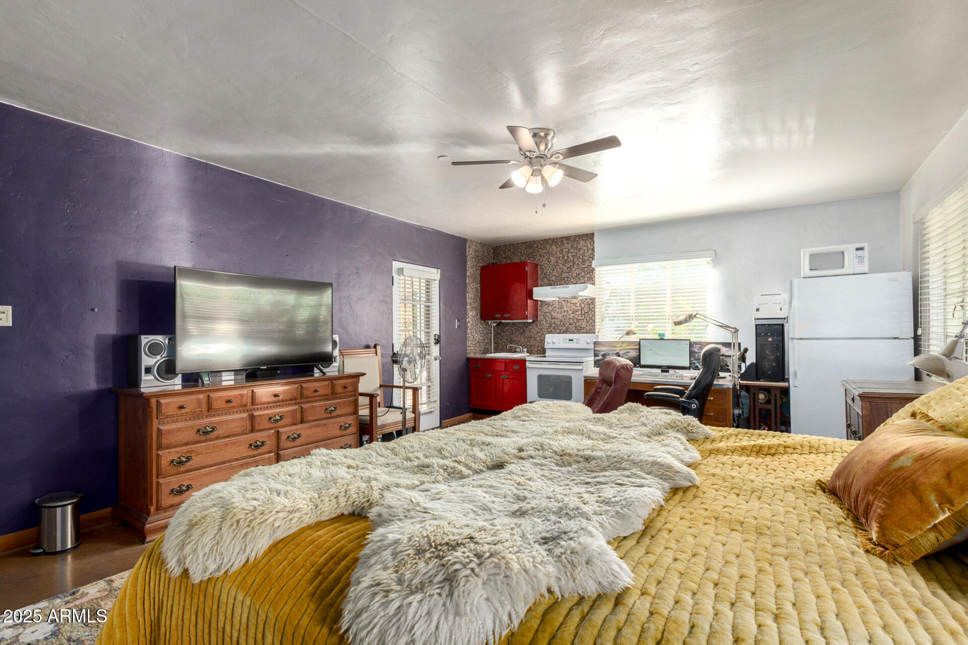 37 West Pasadena Avenue Phoenix, AZ 85013 - Photo 10 of 37 a bed room with a bed and a flat screen tv