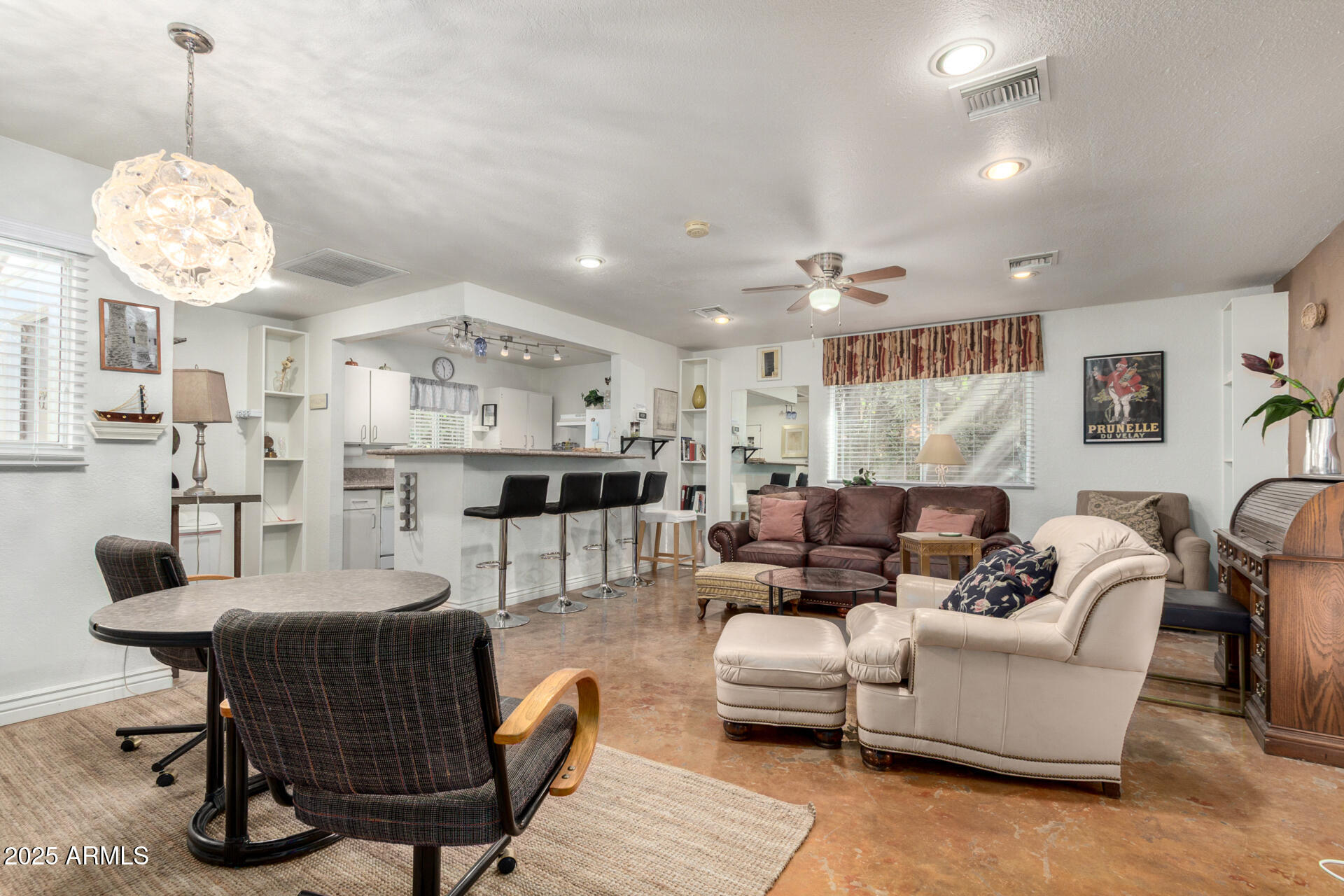 37 West Pasadena Avenue Phoenix, AZ 85013 - Photo 13 of 37 a living room with furniture and a chandelier