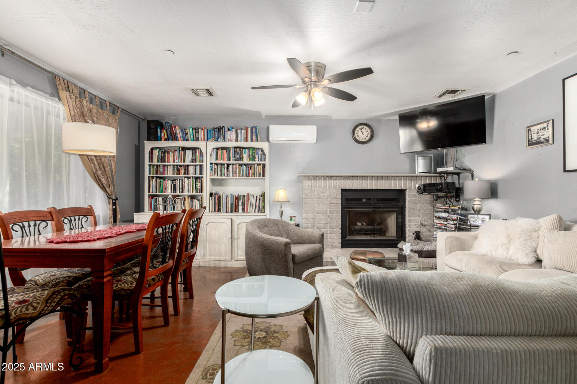37 West Pasadena Avenue Phoenix, AZ 85013 - Photo 14 of 37 a living room with furniture a fireplace and a flat screen tv