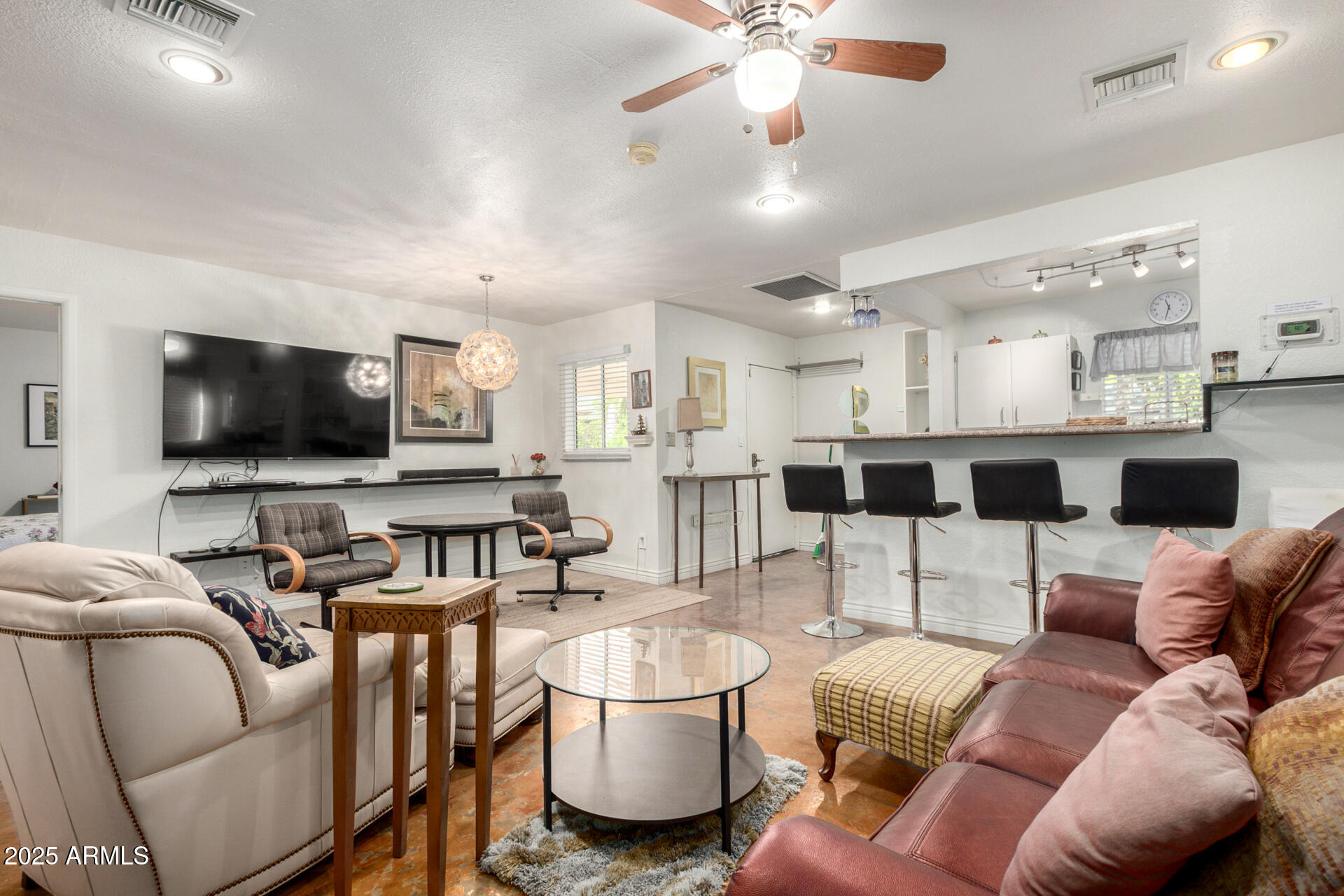 37 West Pasadena Avenue Phoenix, AZ 85013 - Photo 17 of 37 a living room with furniture and a flat screen tv