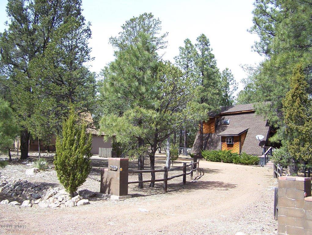 3156 Chevelon Road Overgaard, AZ 85933 - Photo 1 of 46 a view of a park with bench and trees
