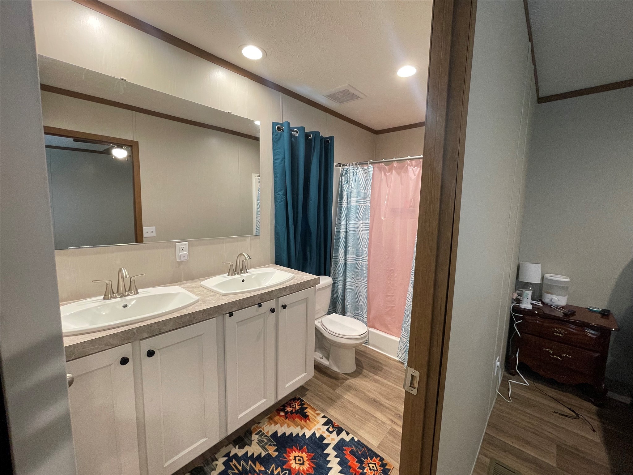 20410 Telge Road, Unit 144 Tomball, TX 77377 - Photo 17 of 20 a bathroom with a double vanity sink and mirror