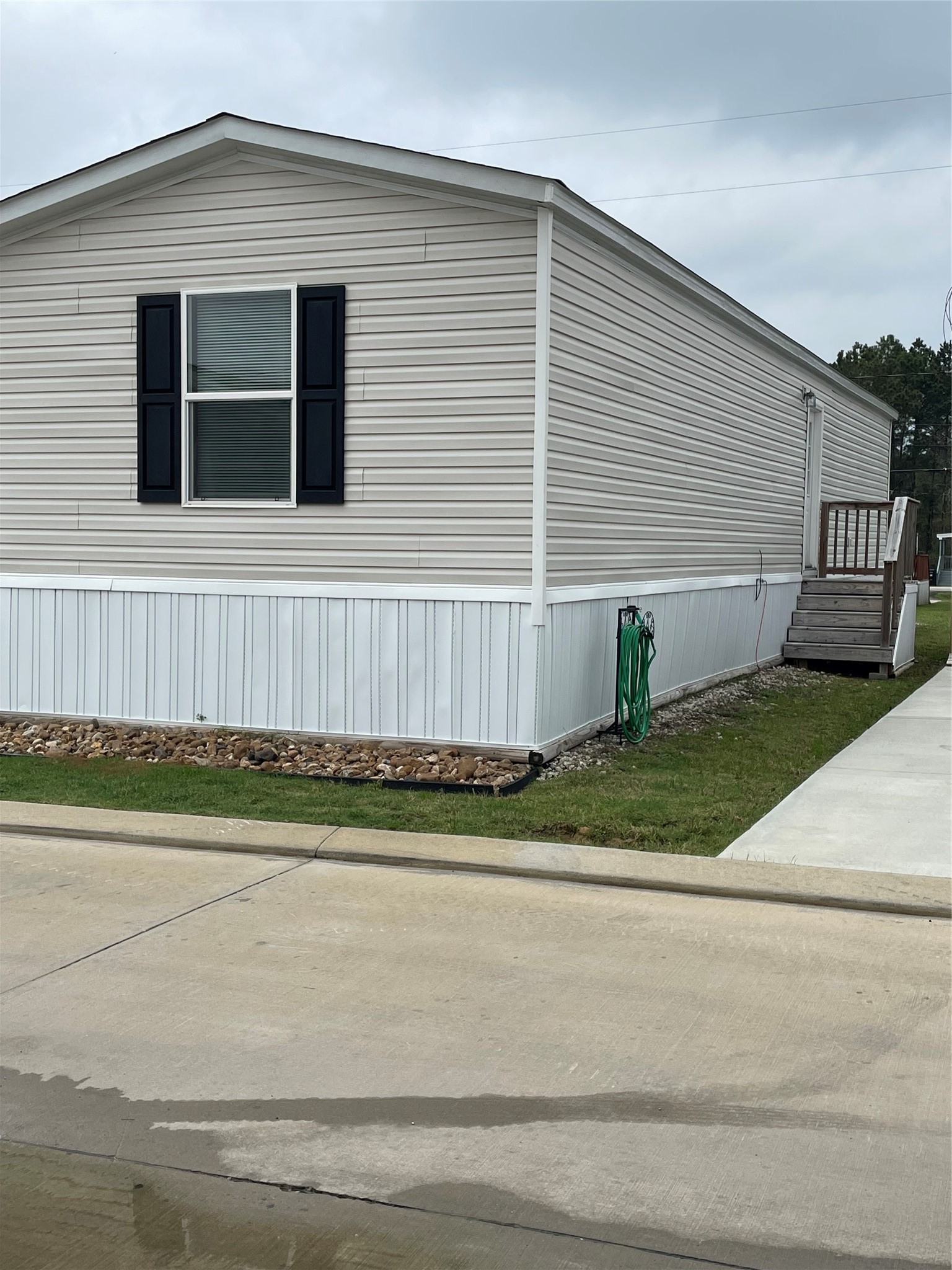 20410 Telge Road, Unit 144 Tomball, TX 77377 - Photo 20 of 20 a view of a house with a yard and sitting area