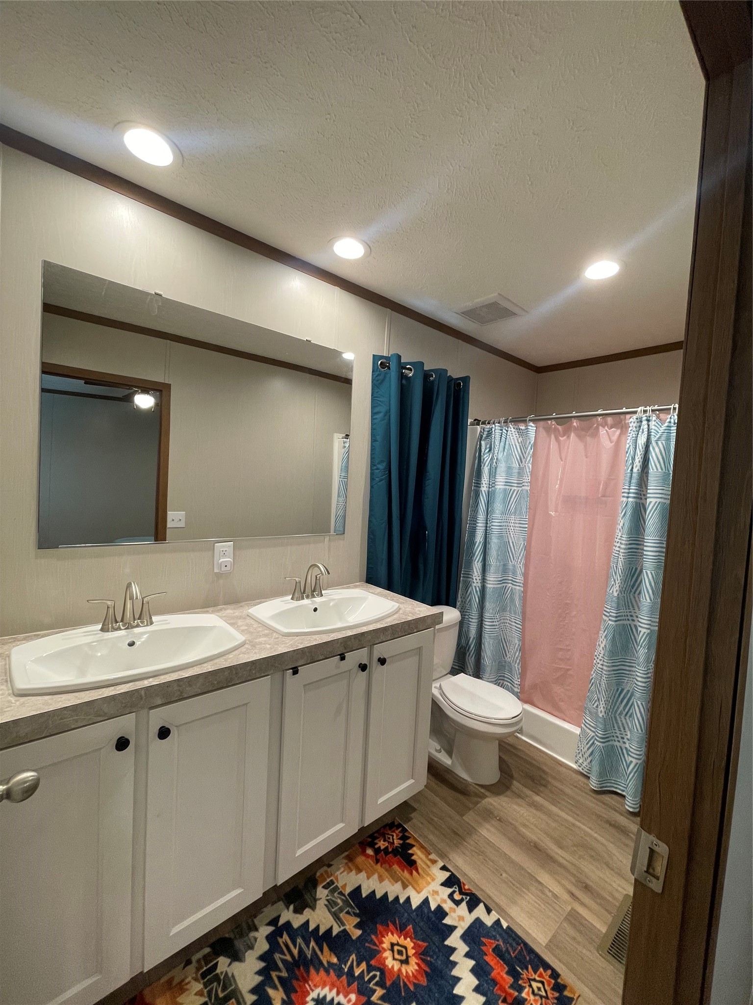 20410 Telge Road, Unit 144 Tomball, TX 77377 - Photo 4 of 20 a bathroom with a double vanity sink and mirror