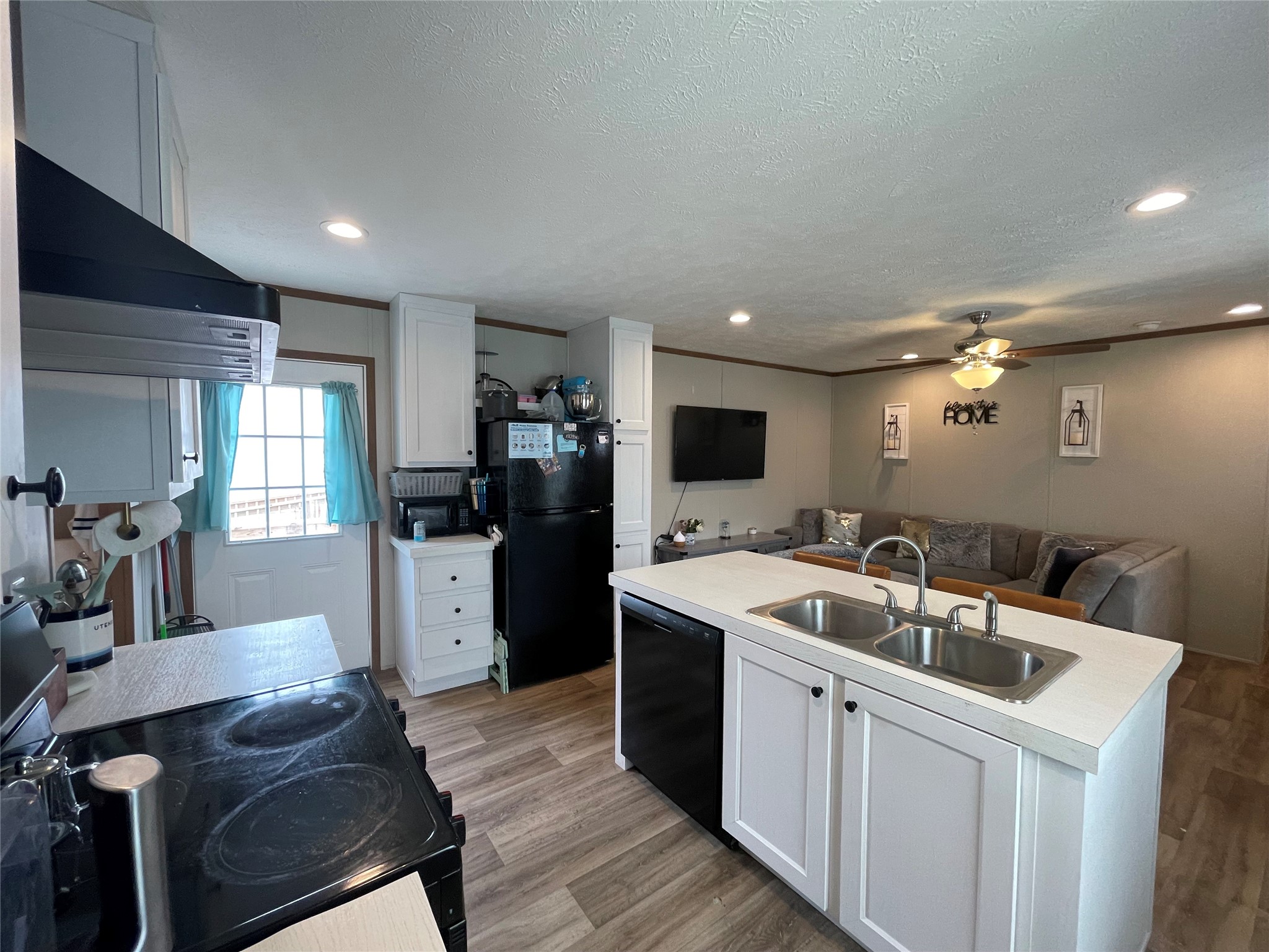 20410 Telge Road, Unit 144 Tomball, TX 77377 - Photo 6 of 20 a kitchen with a sink appliances and cabinets