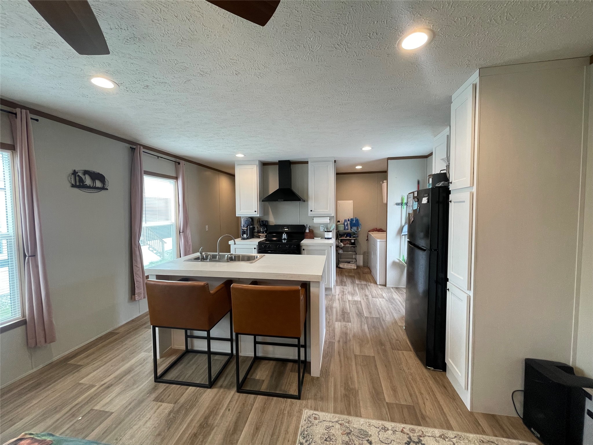 20410 Telge Road, Unit 144 Tomball, TX 77377 - Photo 8 of 20 a view of a dining room with furniture window and wooden floor