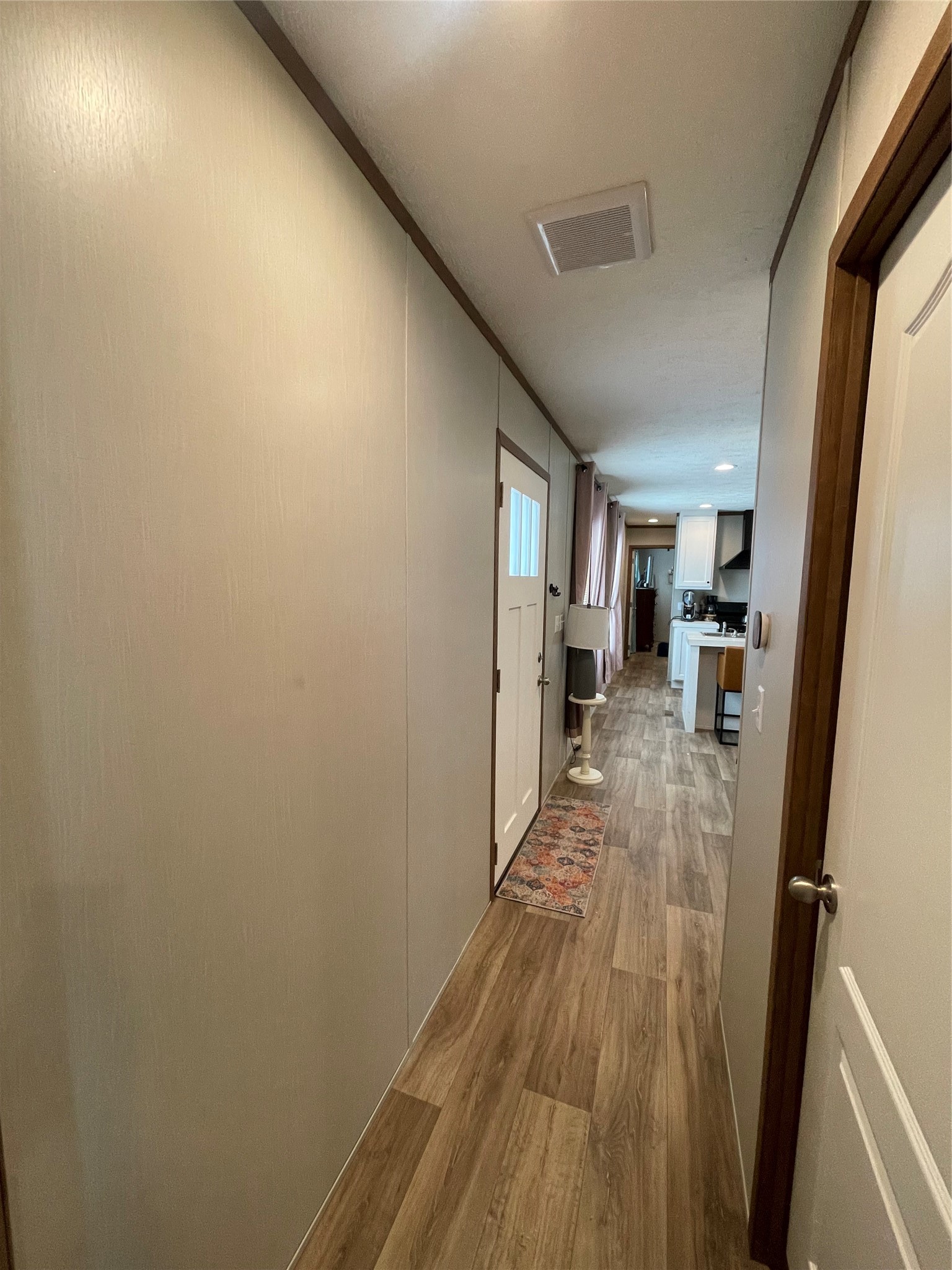 20410 Telge Road, Unit 144 Tomball, TX 77377 - Photo 10 of 20 a view of a hallway with wooden floor and a living room