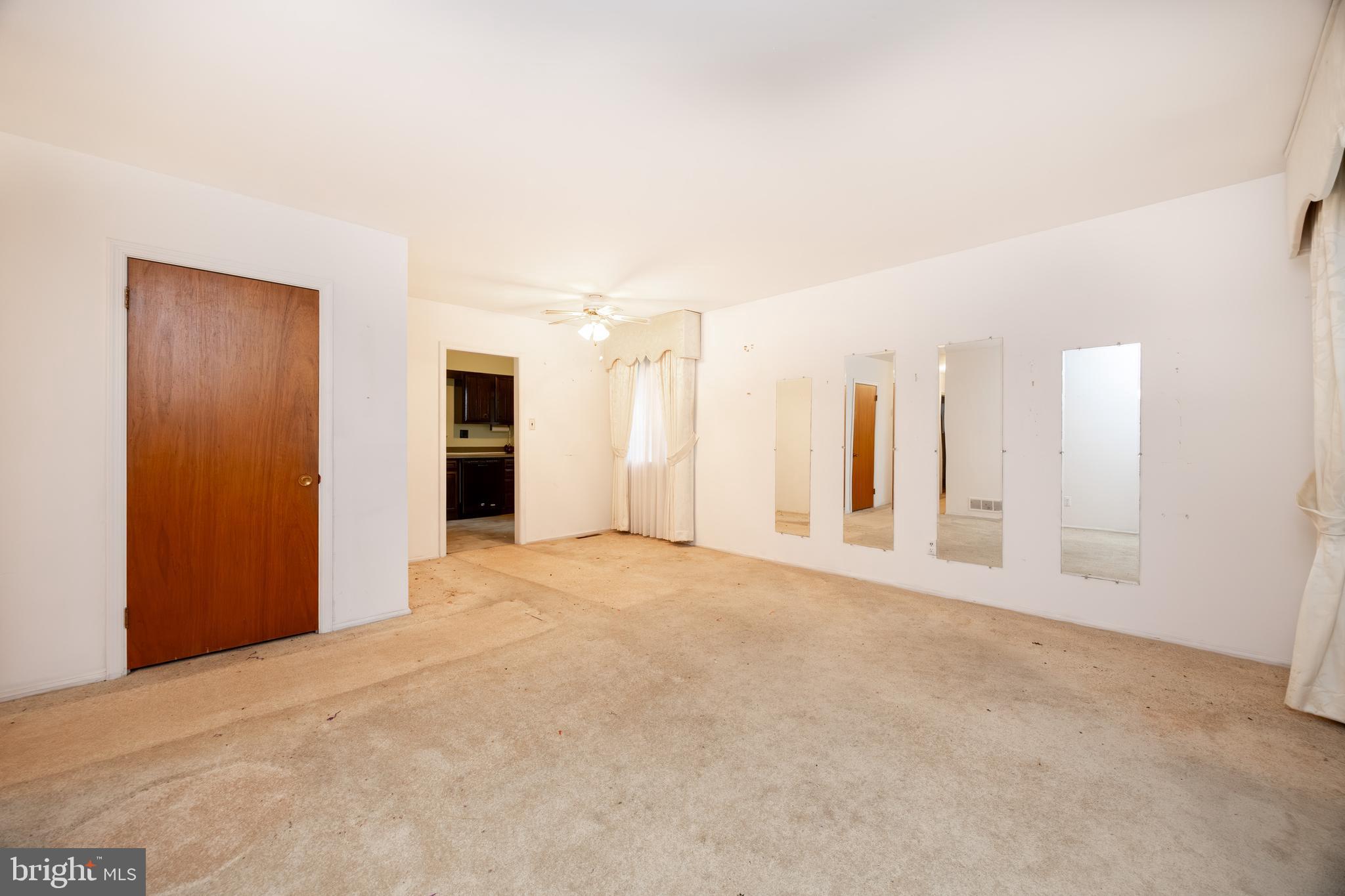 108 Cambridge Road Coatesville, PA 19320 - Photo 4 of 16 a view of an empty room with a cabinet