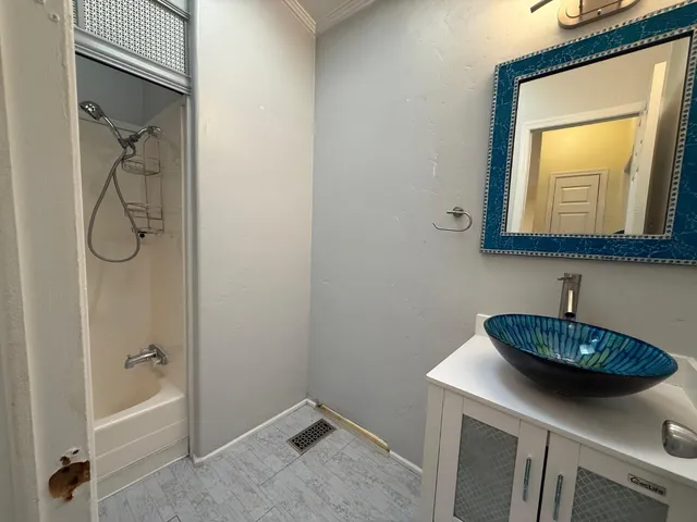 a bathroom with a sink and a bathtub