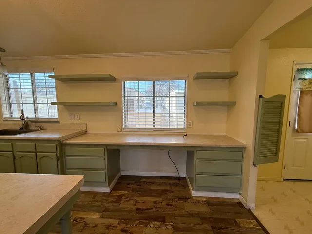 a kitchen with a sink and cabinets